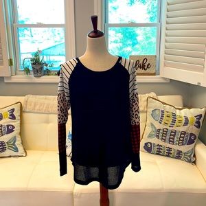 Top-black with mult-color sleeves. Size Med. NWT
